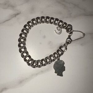 James Avery braclet 
With 2 charms